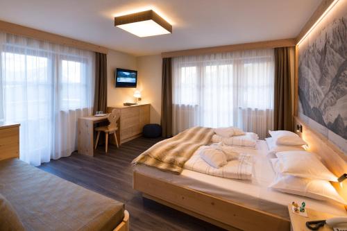 Letto o letti in una camera di Hotel Somont