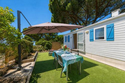 Le Photinia, mobil-home climatisé avec vue mer situé au cœur du domaine