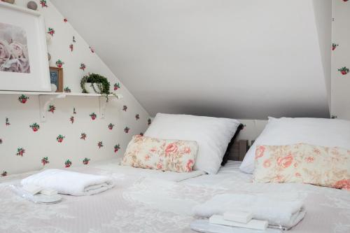 a white bed with two pillows on it at Pokoje w Starej Karczmie - Free Parking - by Upstairs in Liszki
