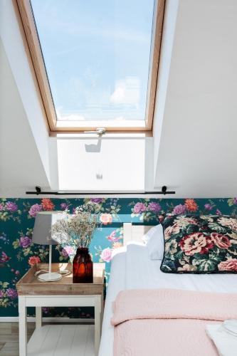 a bedroom with a bed and a window at Pokoje w Starej Karczmie - Free Parking - by Upstairs in Liszki