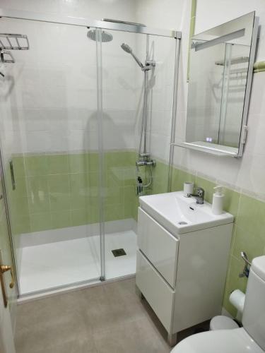 a bathroom with a shower and a sink at Aires de Chipiona Apartamento B in Chipiona
