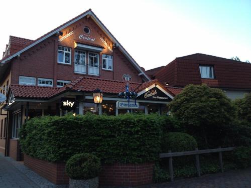 a building with a sign on the front of it at Hotel Central in Zeven