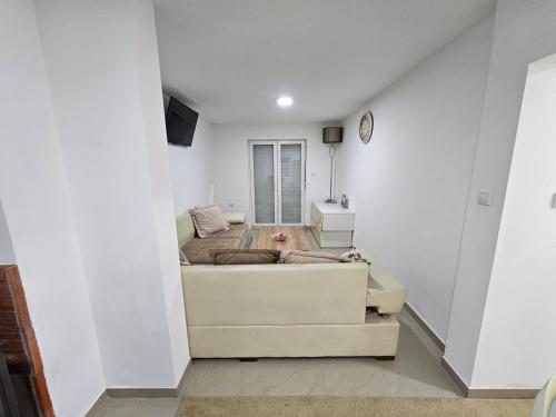 a living room with a couch and a bed at Beogradski mir in Belgrade