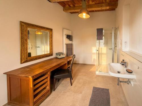 a bathroom with a sink and a mirror at Wauermühle in Lohmen