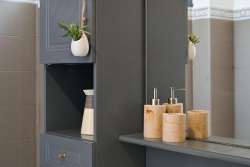 a shelf with four rolls of toilet paper on it at Brunhilde in Montivilliers