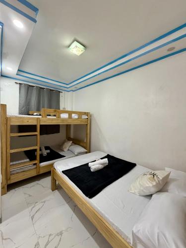 a bedroom with two bunk beds in a room at Beachside Room with Bathroom San Juan ELYU in San Juan