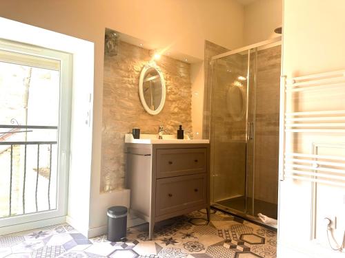 a bathroom with a sink and a shower at Gite de Bourgogne in Sainte-Marie-sur-Ouche