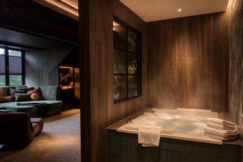 a bathroom with a bath tub in a room at Van der Valk Hotel Harderwijk op de Veluwe in Harderwijk