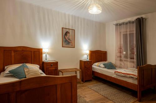 a bedroom with two beds and a window at Holiday House Rea with BBQ and two terrace in Sveti Donat