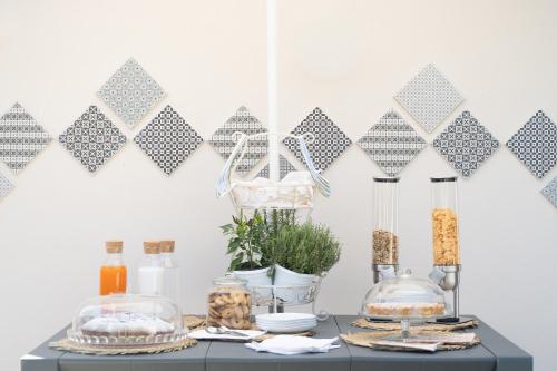 a table with food and other items on it at Grania Le Radici - Agriresort in Gragnano