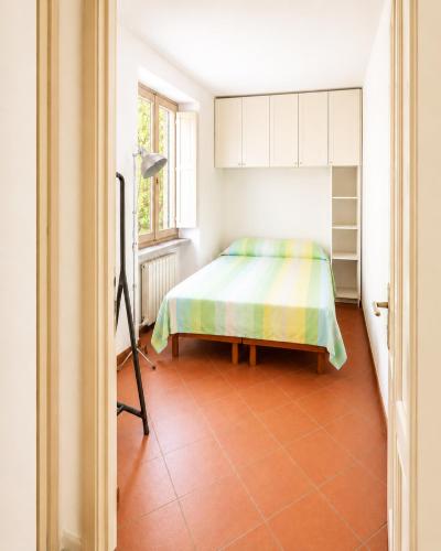 a bedroom with a bed and a window at Bella Maratea in Maratea