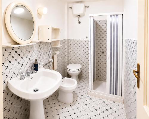a bathroom with a sink and a toilet and a shower at Bella Maratea in Maratea