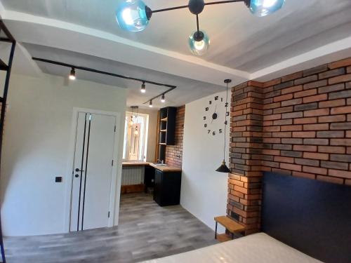 a room with a brick wall and a ceiling at White House in Gyumri