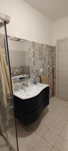 a bathroom with a bath tub in a room at Biagio and Marias house in Trecchina