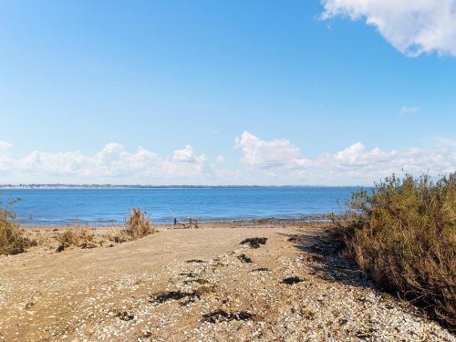 a dirt road leading to the ocean on a beach at Mark Farmhouse in Bradwell on Sea