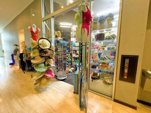 a store with a display of hats and other items at Lyfe Resort Hollywood, Florida in Hollywood