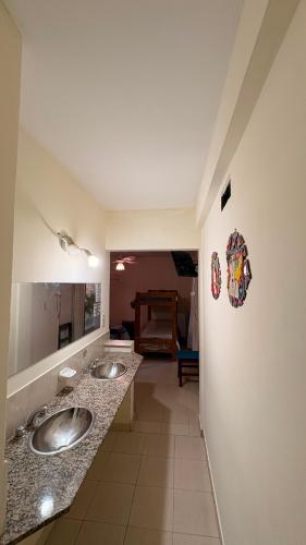 a bathroom with two sinks in a room at Hostel Maranata in Puerto Madryn