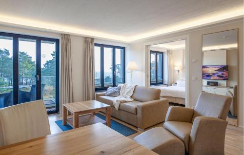 a living room with a couch and a bed at Princess in Binz