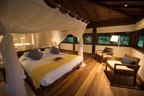 Cama ou camas em um quarto em Txai Resort