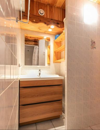 a bathroom with a sink and a shower at Chalet le Vernès Marmotte in Bonneval-sur-Arc