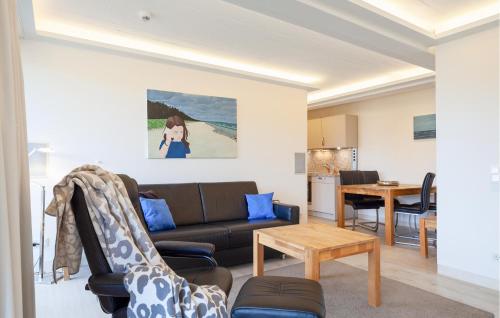 a living room with a couch and a table at Eden in Binz