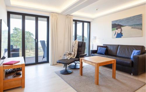 a living room with a couch and a table at Eden in Binz