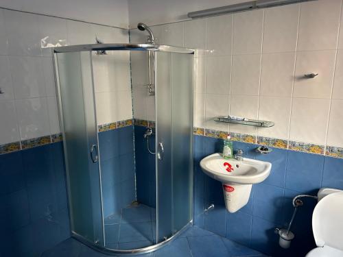 a bathroom with a shower and a sink at Валериевата Къща 2 in Shiroka Laka