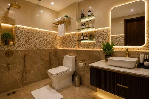 a bathroom with a toilet and a sink and a mirror at Hotel ORIGIN Hyderabad Airport in Hyderabad