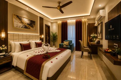 a bedroom with a large bed with a swan on it at Hotel ORIGIN Hyderabad Airport in Hyderabad