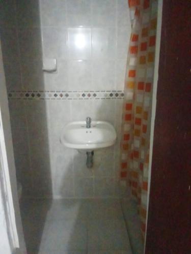 a bathroom with a white sink in a room at Reina Elizabeth I in Santa Marta