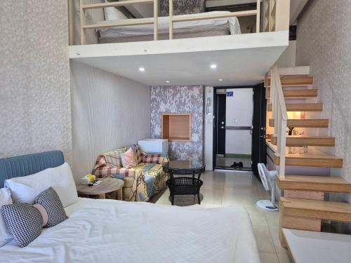 a bedroom with a loft bed and a living room at 元本山明水秀行館 in Jiaoxi