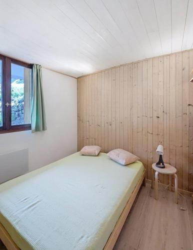 a bedroom with a large bed and a window at Evasion in Orcières