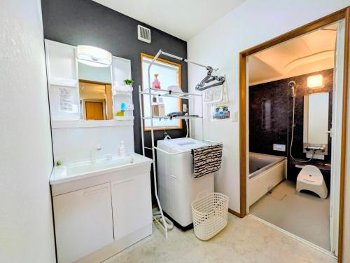 a bathroom with a sink and a toilet and a shower at Frog Inn - Entire House for Private Use in Fujinomiya