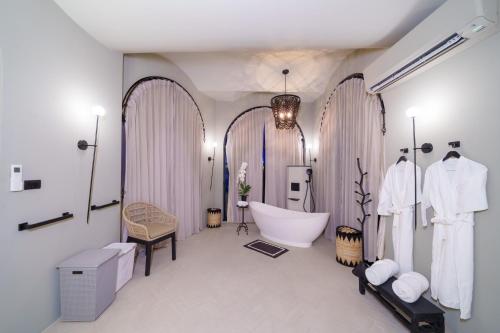 a large bathroom with a tub and a sink at Ladylagoon Luxury Multi-Purpose Private Beachfront Villas Koh Samui in Koh Samui