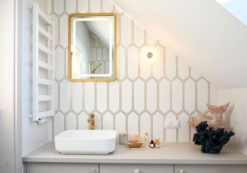 a bathroom with a sink and a mirror at Velur Haus in Borne Sulinowo