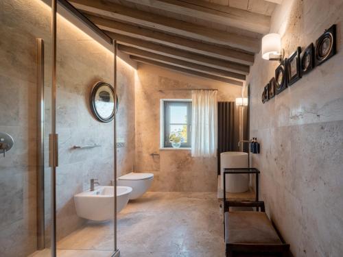 a bathroom with a shower and a sink and a toilet at Tenuta Bartoli in San Gimignano