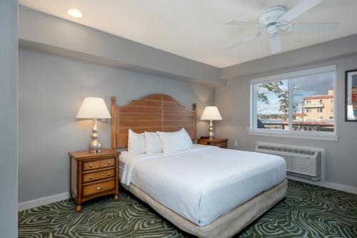 a bedroom with a large white bed and a window at WorldMark Birch Bay in Birch Bay