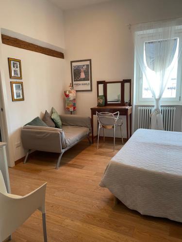 a living room with two beds and a couch at BnB Centro Centro in Ascoli Piceno