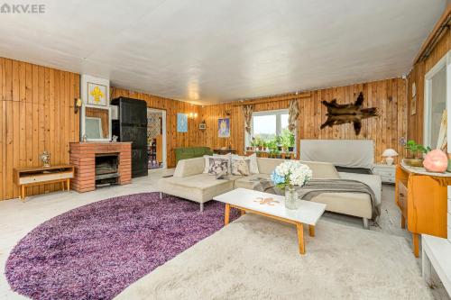 a living room with a purple rug at Zen Garden House in Võduvere