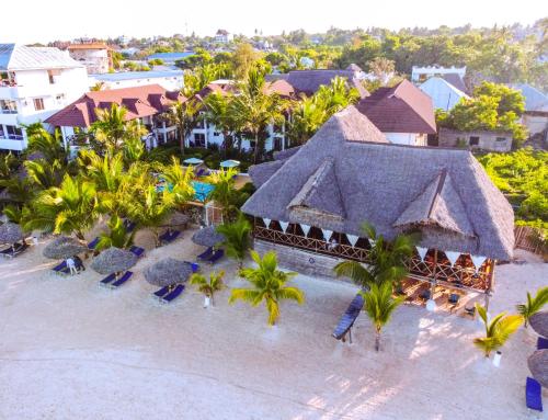 an aerial view of a resort with chairs and palm trees at Sansi Kendwa Beach Resort in Kendwa