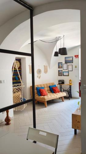 a living room with a couch and a table at Mirador in Beja