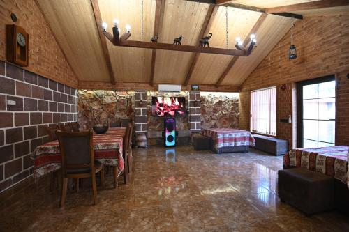 a large room with a table and chairs in it at ARBAT house LUXURY in Arbatʼ