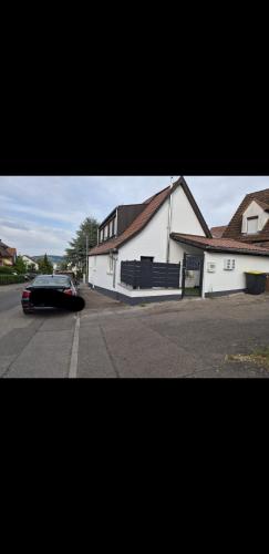 a car parked in front of a white building at Nektarios Apartments in Kernen