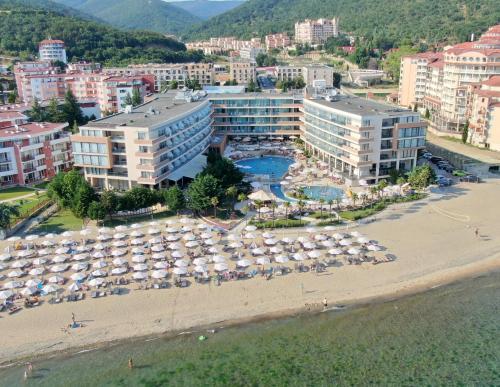 an aerial view of a beach with umbrellas and buildings at Sandy Bay Resort - All Inclusive Private Beach Hotel in Sveti Vlas