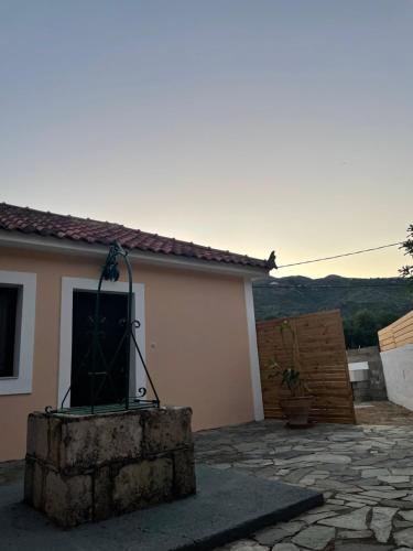 a small house with a window and a door at Anabelis studios & apartments in Katelios