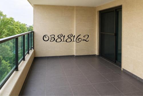 a balcony with a sign on the side of a building at chalet in saint remon in Al Bāţiyah