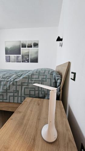 a table in a room with a bed and a table sidx sidx sidx at Drago 48 in Oltre il Colle
