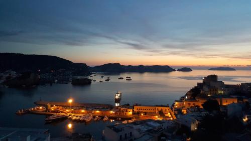 a view of a harbor at night with boats in the water at Villa Ersilia in Ponza