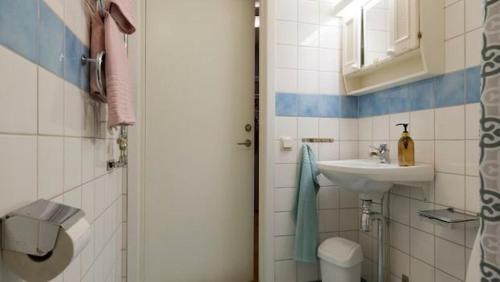 a small bathroom with a sink and a toilet at Apartment in Skarholmen Stockholm 206 in Stockholm