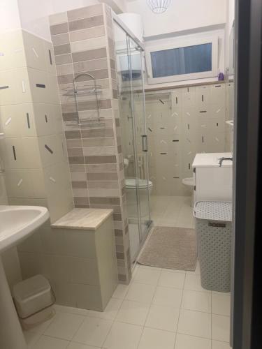 a bathroom with a shower and a sink and a toilet at Via Clitunno 24 in Foligno